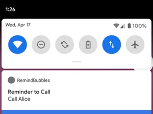 A smartphone notification panel showing a reminder to call Alice on April 17 at 1:26 PM, with various app icons above.